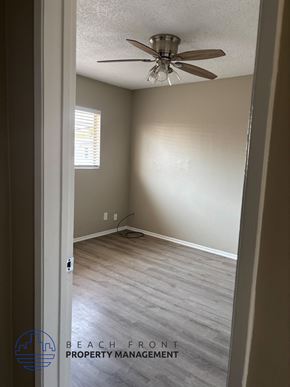 Anaheim apartment for rent - A room with a ceiling fan and wooden flooring.